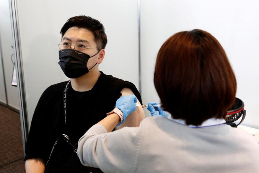 A man receives the Moderna coronavirus vaccine at the Tokyo Metropolitan Government building in Tokyo, Japan on June 25, 2021 — Pool via REUTERS