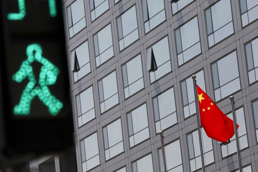 A Chinese national flag flutters outside the China Securities Regulatory Commission (CSRC) building in Beijing, China on July 9, 2021 — Reuters/Files