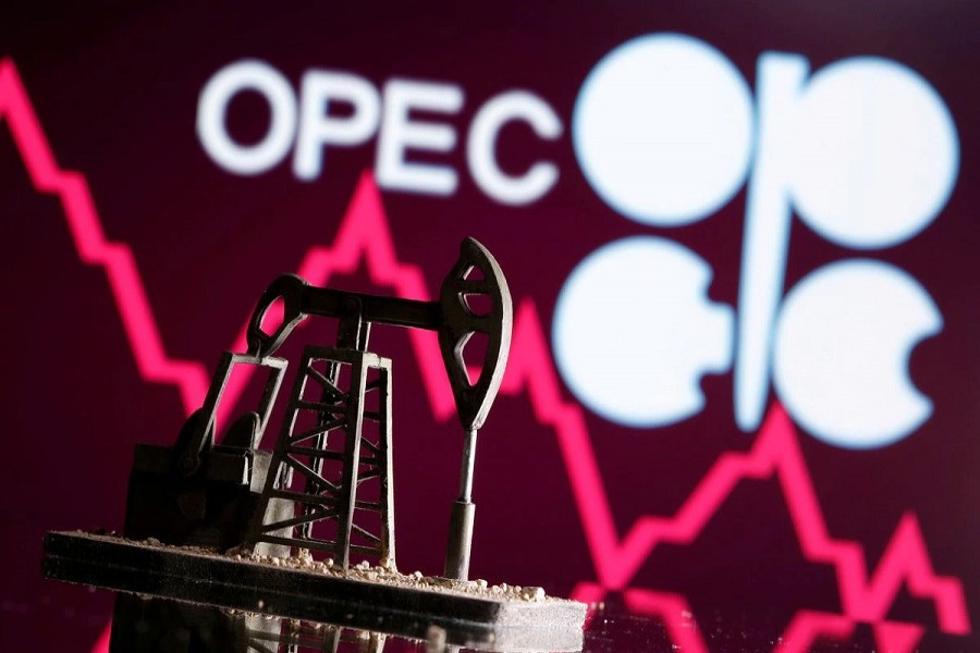 A 3D printed oil pump jack is seen in front of displayed stock graph and Opec logo in this illustration picture, April 14, 2020 — Reuters/ Dado Ruvic/Illustration