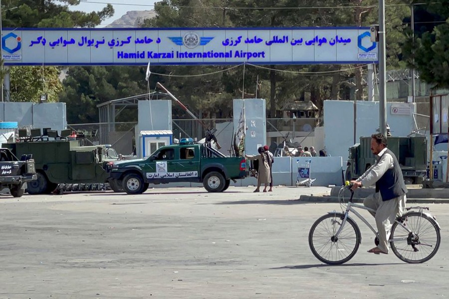 Taliban stand at the entrance gate of Hamid Karzai International airport while Taliban forces block the roads around the airport after yesterday's explosions in Kabul, Afghanistan on August 27, 2021 — Reuters photo