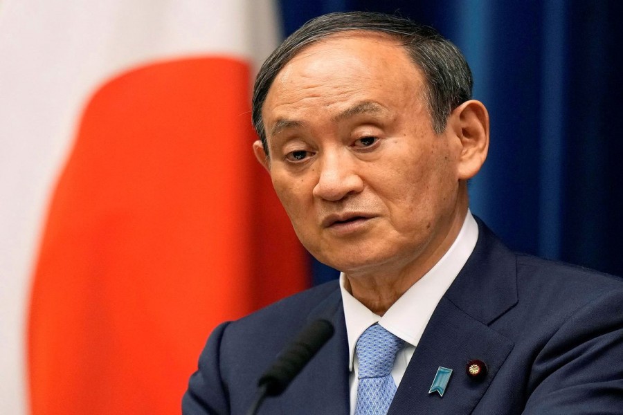 Japanese Prime Minister Yoshihide Suga speaks during a news conference announcing to extend a state of emergency on COVID-19 pandemic at prime minister's official residence in Tokyo, Japan, August 17, 2021. Kimimasa Mayama/Pool via REUTERS//File Photo