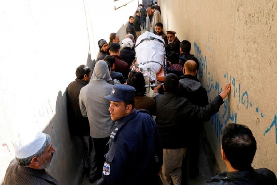 Relatives carry the body of a female judge shot dead by unknown gunmen in Kabul, Afghanistan January 17, 2021  — Reuters/Files