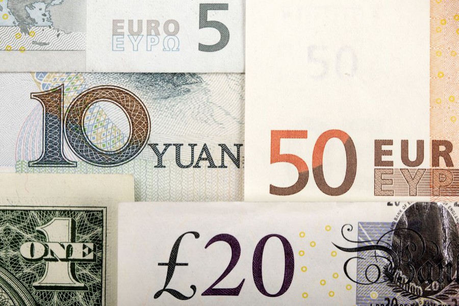 Arrangement of various world currencies including Chinese yuan, U.S. dollar, Euro, British pound, pictured January 25, 2011 — Reuters illustration