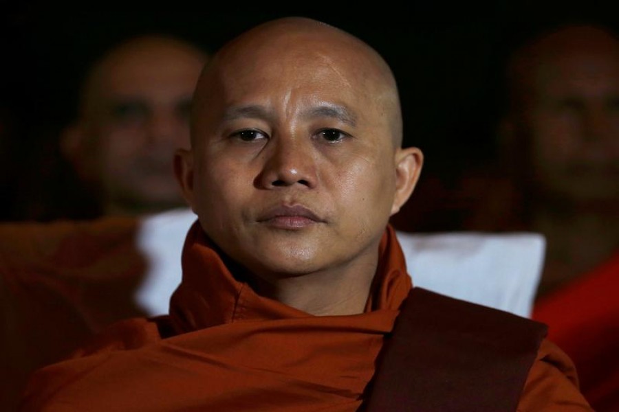 Buddhist monk Ashin Wirathu looks on as he attends a convention held by the Bodu Bala Sena (Buddhist Power Force, BBS) in Colombo September 28, 2014. REUTERS/Dinuka Liyanawatte/File Photo