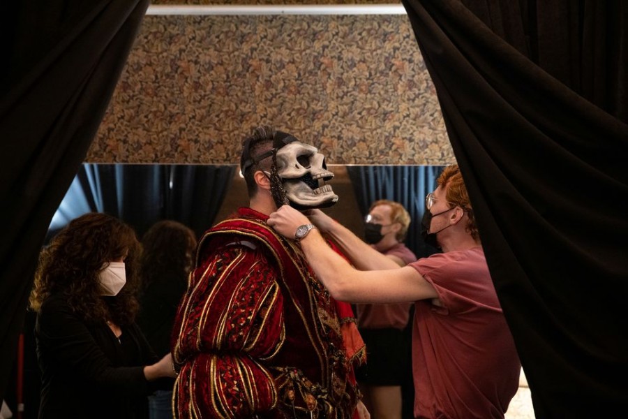 Production Tailor Annette Lovece and Dresser Jimmy O'Donnell adjust an outfit worn by actor Ben Crawford during a fitting at the Majestic Theater in Manhattan, New York City, U.S., September 3, 2021. Picture taken September 3, 2021. REUTERS/Caitlin Ochs