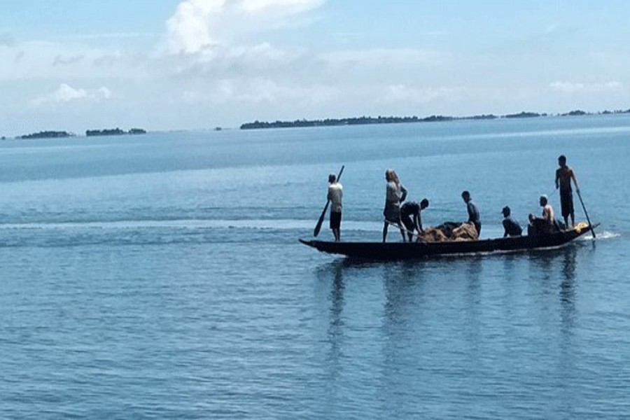 Fishermen busy fishing in Tanguar Haor in Sunamganj — FE Photo