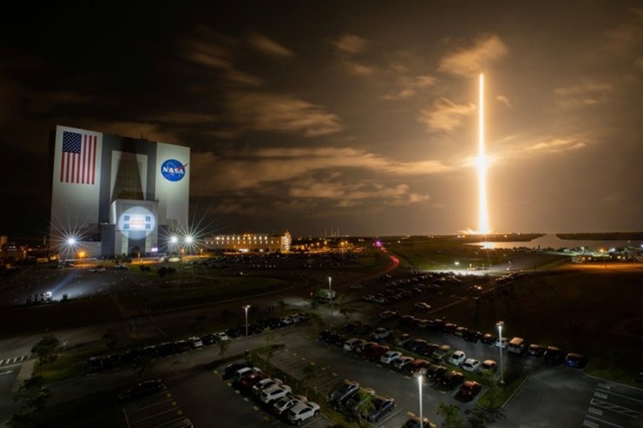 With a view of the iconic Vehicle Assembly Building at left, a SpaceX Falcon 9 rocket soars upward from Launch Complex 39A carrying the company’s Crew Dragon Endeavour capsule and four Crew-2 astronauts towards the International Space Station at NASA’s Kennedy Space Center in Cape Canaveral, Florida, US on April 23, 2021 — NASA Handout via REUTERS