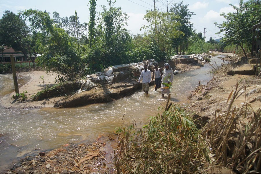 Water passing through ditches developed on Tahirpur-Tekerghat road by rolling waters from Meghalaya hills — FE Photo