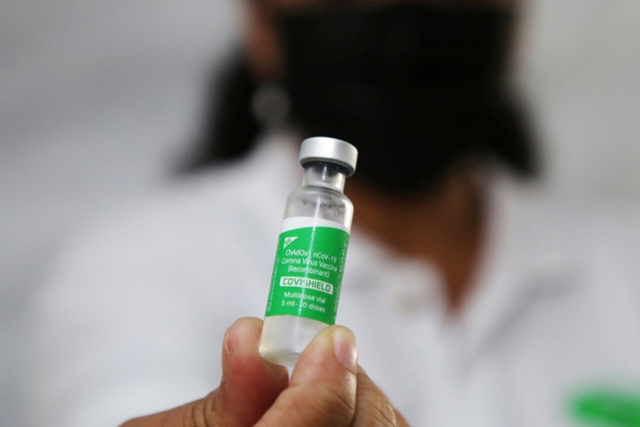 A health worker holds a vial with doses of the Oxford-AstraZeneca vaccine, marketed by the Serum Institute of India (SII) as COVISHIELD, against the coronavirus disease (Covid-19), in Paramaribo, Suriname on February 23, 2021 — Reuters/Files