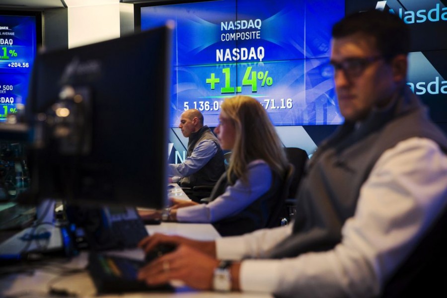 Traders work at their desks at the Nasdaq MarketSite in New York June 18, 2015 — Reuters/Lucas Jackson/File Photo