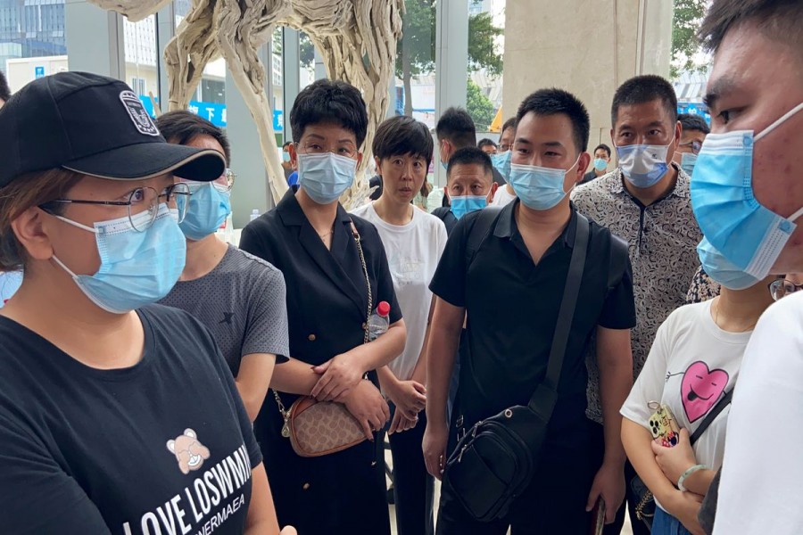 People gather to demand repayment of loans and financial products at the lobby of Evergrande's Shenzhen headquarter, Guangdong province, China September 13, 2021 — Reuters