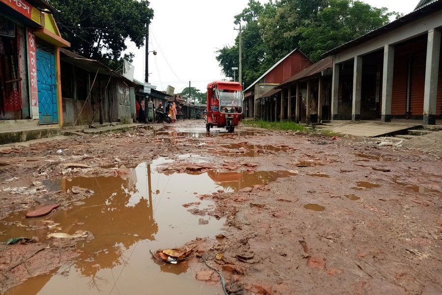 The dilapidated Rupganj Bausi Bazar road at Barhatta Upazila of Netrakona — FE Photo