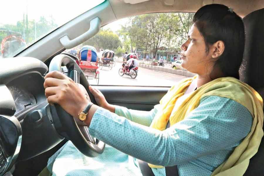 A woman driving a car near Bangabhaban in the city —FE file photo