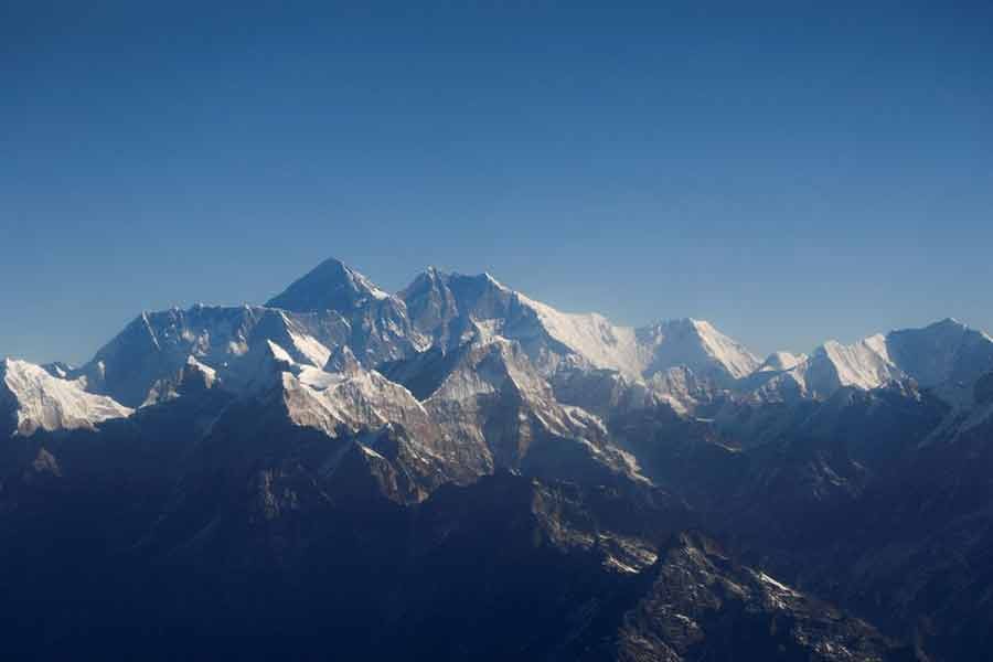 Mount Everest, the world highest peak, and other peaks of the Himalayan range are seen through an aircraft window during a mountain flight from Kathmandu of Nepal on January 15 last year –Reuters file photo