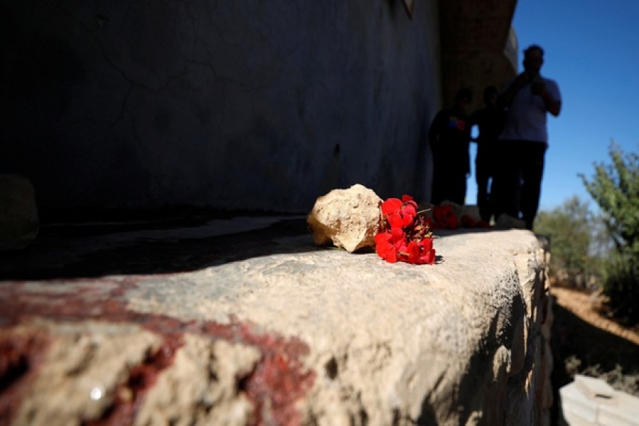 People check the scene where three Palestinians were killed by Israeli forces during a raid, in Beit Anan in the Israeli-occupied West Bank Sept 26, 2021 -- Reuters/Mohamad Torokman