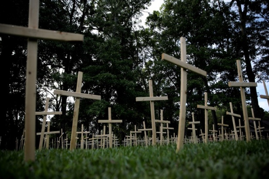 Crosses are seen outside of a church, as each cross represents one life lost to coronavirus disease (COVID-19) in the state of Louisiana, in Baton Rouge, Louisiana US, April 10, 2020. REUTERS