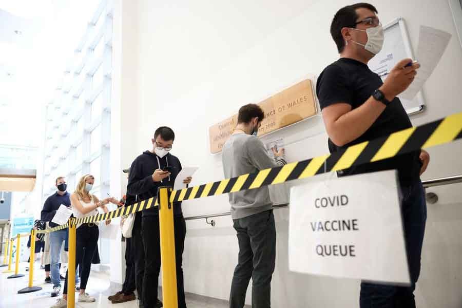 People waiting in a queue to receive a dose of the Pfizer BioNTech vaccine at the Central Middlesex Hospital in London of Britain on August 1 this year –Reuters file photo