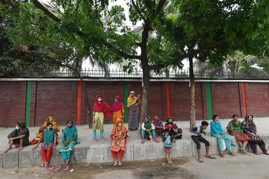 Low-income people hit hard by Covid-19 outbreak wait for collecting relief materials amid a shutdown in Dhaka, Bangladesh — Xinhua/Filews