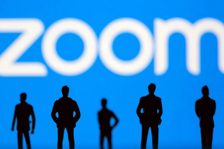 Small toy figures are seen in front of the Zoom logo in this illustration picture taken on March 15, 2021 — Reuters/Files