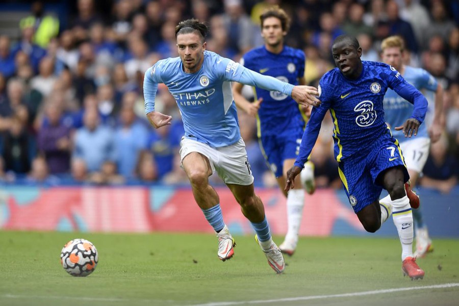 Football - Premier League - Chelsea v Manchester City - Stamford Bridge, London, Britain - September 25, 2021 Manchester City's Jack Grealish in action with Chelsea's N'Golo Kante Reuters/Toby Melville /File Photo