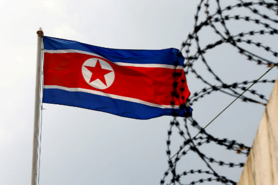 A North Korea flag flutters next to concertina wire at the North Korean embassy in Kuala Lumpur, Malaysia March 9, 2017. REUTERS/Edgar Su