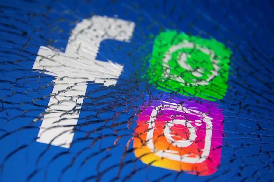 Facebook, Whatsapp and Instagram logos are displayed through broken glass in this illustration taken on October 4, 2021 — Reuters/Files