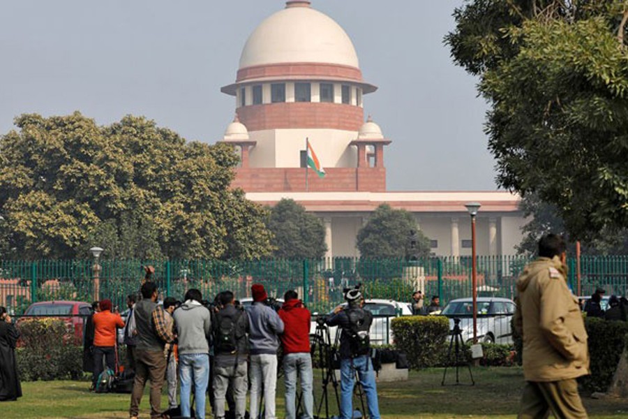 Television journalists are seen outside the premises of the Supreme Court in New Delhi, India, January 22, 2020. REUTERS/Anushree Fadnavis