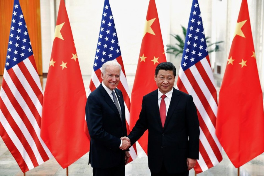 Chinese President Xi Jinping shakes hands with US Vice President Joe Biden (L) inside the Great Hall of the People in Beijing December 4, 2013. REUTERS/Lintao Zhang/Pool//File Photo