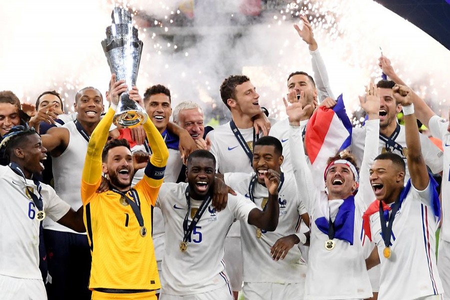 France's Hugo Lloris lifts the trophy as they celebrate after winning the Nations League