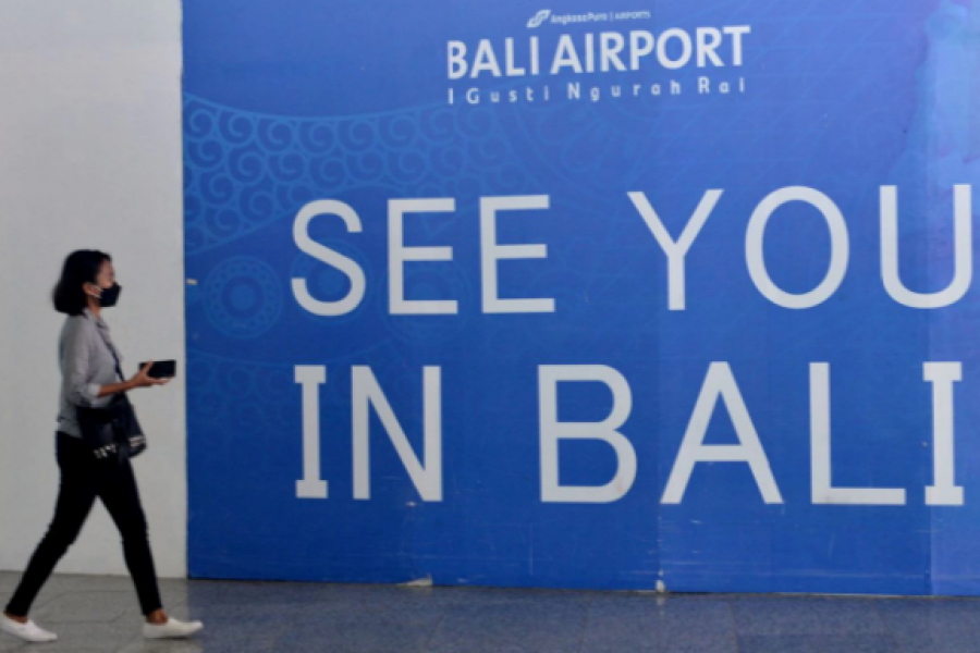 A passenger walks at Ngurah Rai International Airport as Indonesia's resort island of Bali is set to reopen for international flights on October 14 after border closures due to the coronavirus disease (COVID-19) pandemic in Badung, Bali, Indonesia October 5, 2021, in this photo taken by Antara Foto. Antara Foto/Fikri Yusuf/via REUTERS