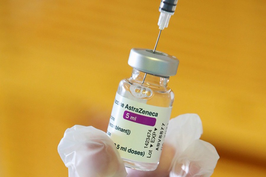 A medical worker holds a vial of AstraZeneca COVID-19 vaccine at a vaccination center, amid the coronavirus disease outbreak, in Ronquieres, Belgium Apr 6, 2021. REUTERS