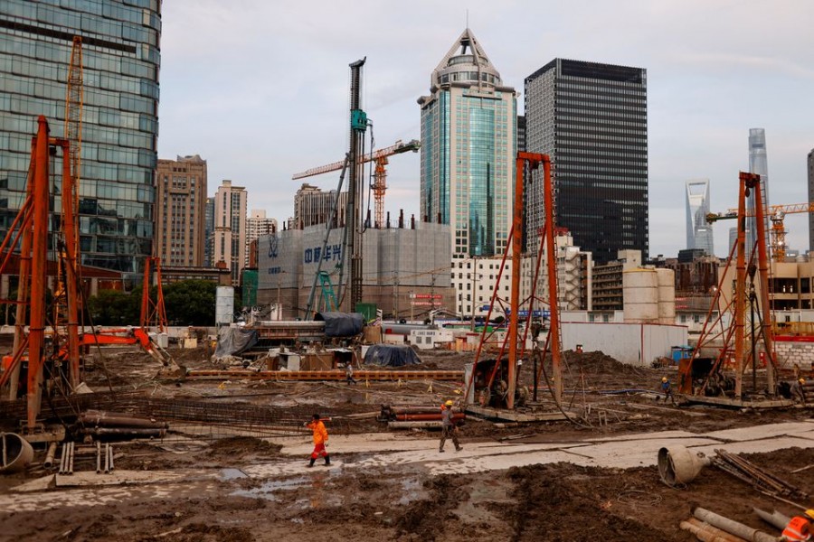 Labourers at a construction site in Shanghai, China. Picture taken on July 12, 2021 — Reuters/Files