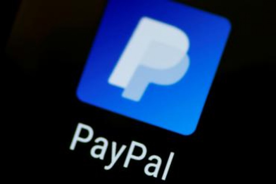 FILE PHOTO: The PayPal app logo seen on a mobile phone in this illustration photo October 16, 2017. REUTERS/Thomas White/Illustration