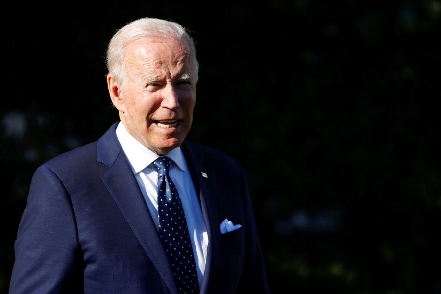 US President Joe Biden speaks briefly with reporters after participating in a ceremony for state and national Teachers of the Year at the White House in Washington, US, October 18, 2021. REUTERS/Jonathan Ernst/File Photo