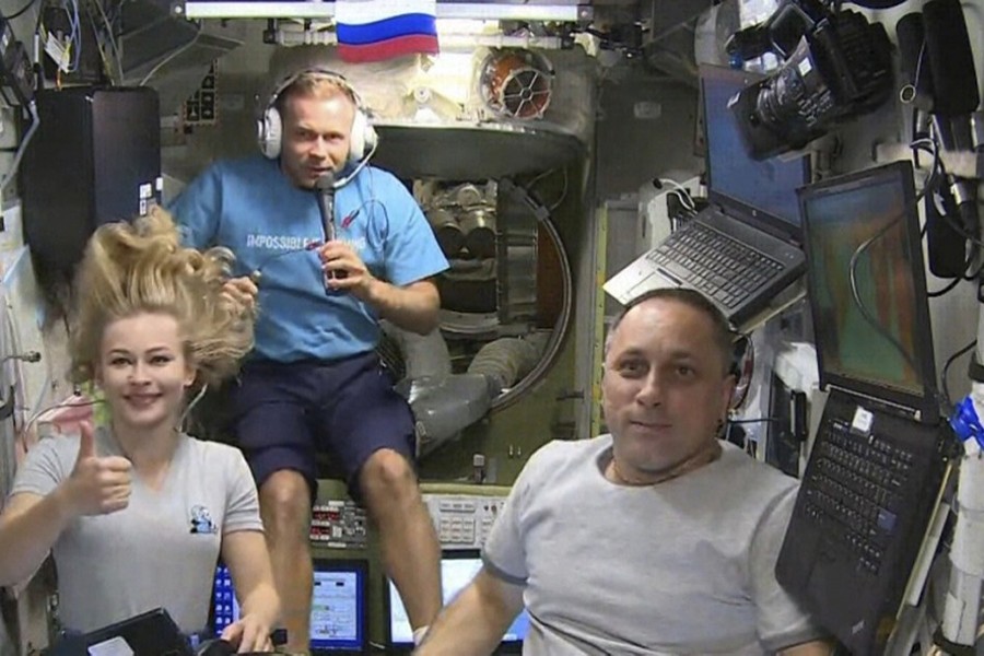 Yulia Peresild, left, film director Klim Shipenko, centre, and cosmonaut Anton Shkaplerov  — Photo via AP