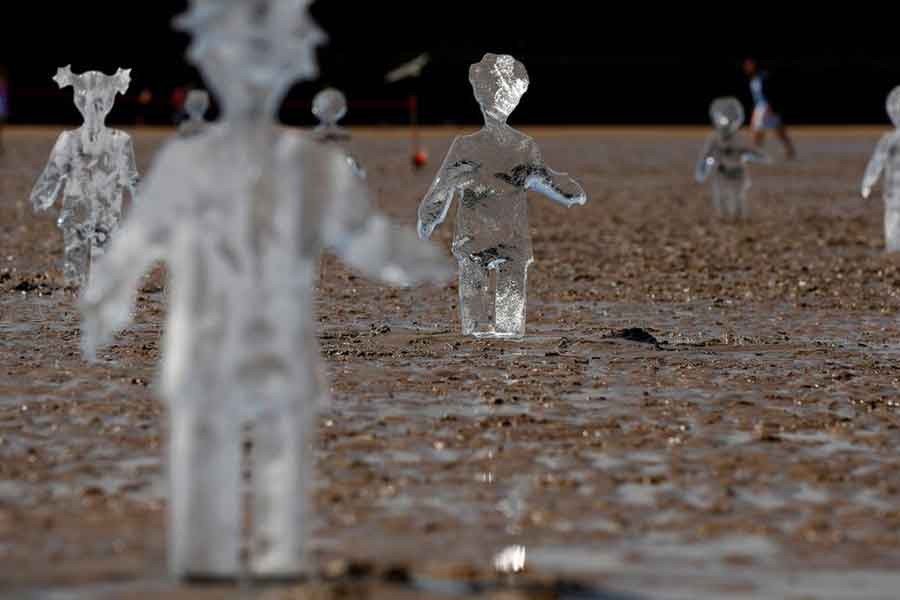 Ice sculptures of children created by Sand in Your Eye to highlight the importance of COP26, the global climate conference, are seen at New Brighton Beach on the Wirral peninsular in New Brighton of Britain on May 31 this year –Reuters file photo