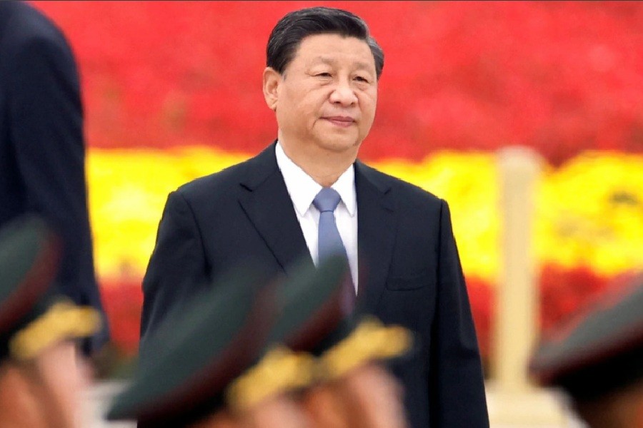 Chinese President Xi Jinping arrives for a ceremony at the Monument to the People's Heroes on Tiananmen Square to mark Martyrs' Day, in Beijing, China September 30, 2021. REUTERS/Carlos Garcia Rawlins/Files