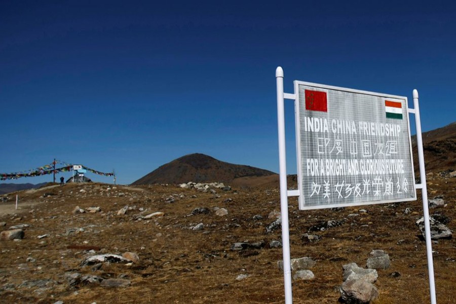 A signboard is seen from the Indian side of the Indo-China border at Bumla, in the northeastern Indian state of Arunachal Pradesh, on November 11, 2009 — Reuters/Files