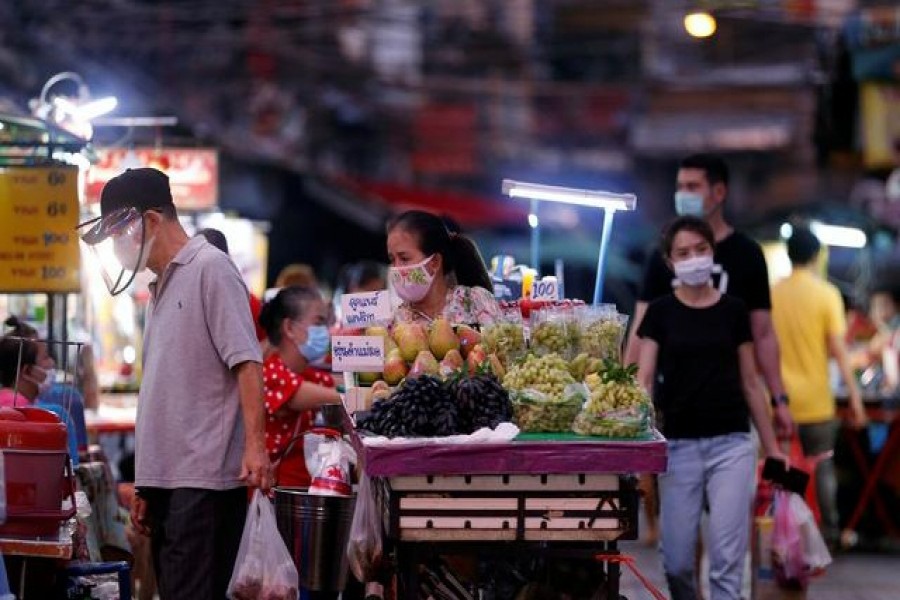 Vendors wearing protective masks sell food in Chinatown, after the government started opening some restaurants outside shopping malls, parks and barbershops during the coronavirus disease (Covid-19) outbreak in Bangkok, Thailand, May 3, 2020 — Reuters/Files