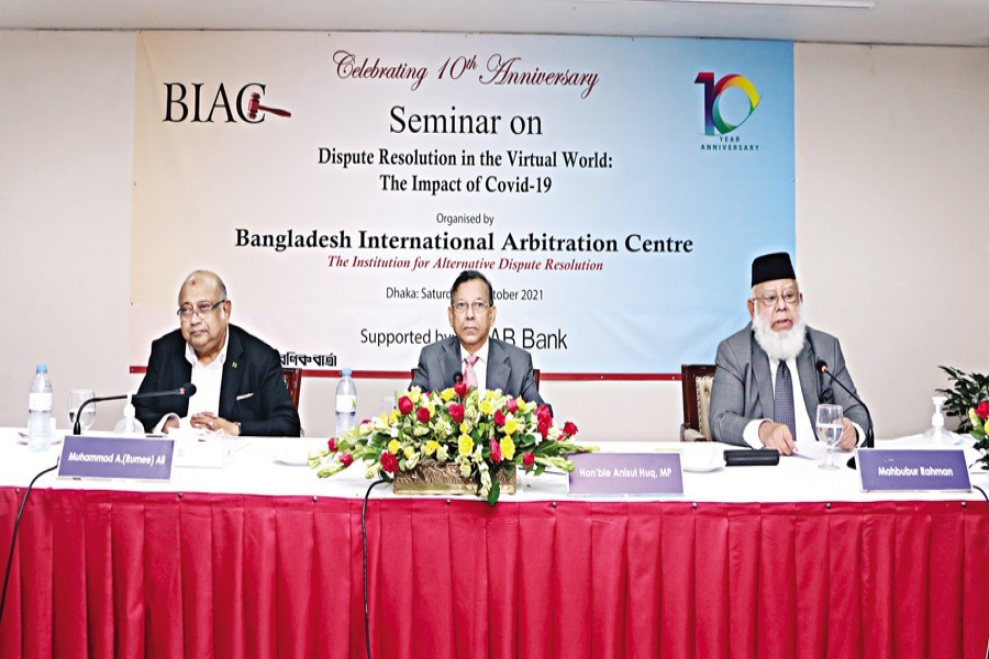 Law Minister Anisul Huq (centre), BIAC Chairman Mahbubur Rahman (right), and BIAC CEO Muhammad A (Rumee) Ali (left) at a seminar titled 'Dispute Resolution in the Virtual World: The Impact of Covid-19' held at a city hotel on Saturday