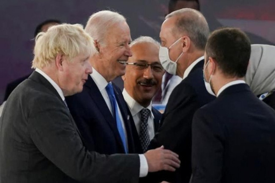 US President Joe Biden talks with Turkey's President Tayyip Erdogan and Britain's Prime Minister Boris Johnson as he attends the G20 leaders' summit in Rome, Italy October 30, 2021 – Reuters/Kevin Lamarque/Pool