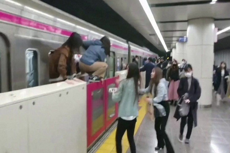 Video from the incident shows people jumping out of the train as it fills with smoke - Reuters photo