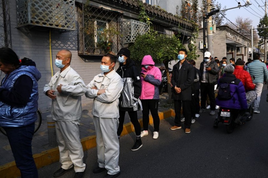 People line up outside a vaccination site after the city started offering booster shots of the vaccine against the coronavirus disease (Covid-19) to vaccinated residents, in Beijing, China on October 29, 2021 — Reuters/Files