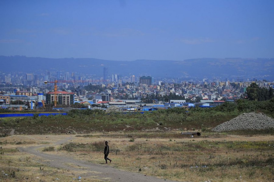 A man walks on the outskirts of Addis Ababa, Ethiopia, November 5, 2021. REUTERS/Tiksa Negeri