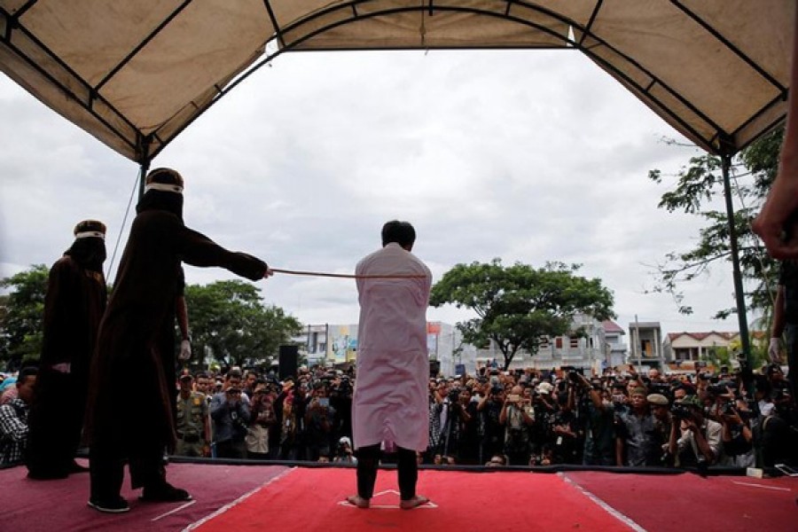 An Indonesian man is publicly caned for having gay sex in Banda Aceh, Aceh province, Indonesia May 23, 2017. Reuters/FILE