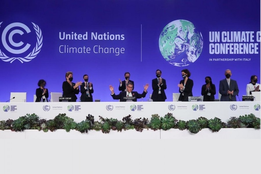 COP26 President Alok Sharma gestures as he receives applause during the UN Climate Change Conference (COP26) in Glasgow, Scotland, Britain November 13, 2021. Reuters