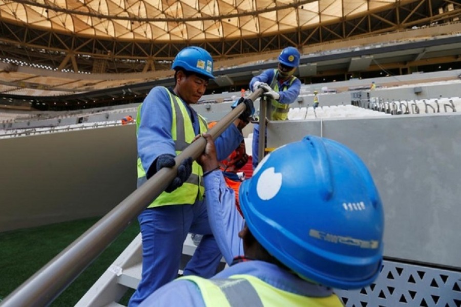 Workers put final touches inside of the Lusail Stadium, the venue for the 2022 Qatar World Cup final, Lusail, Qatar, Nov 18, 2021. REUTERS/Hamad I Mohammed