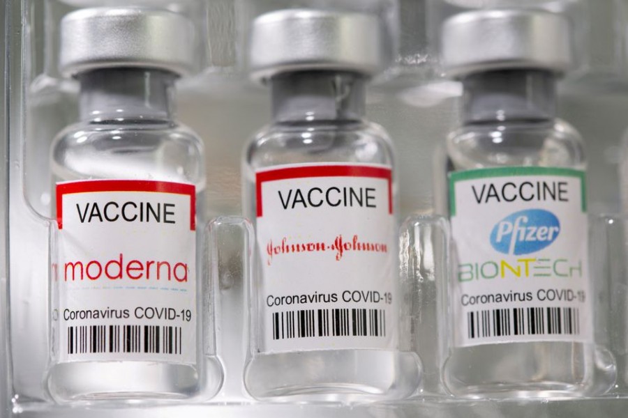 Vials labelled "Moderna, Johnson & Johnson, Pfizer-BioNTech coronavirus disease (Covid-19) vaccine" are seen in this illustration picture taken May 2, 2021 – Reuters/Dado Ruvic/File Photo