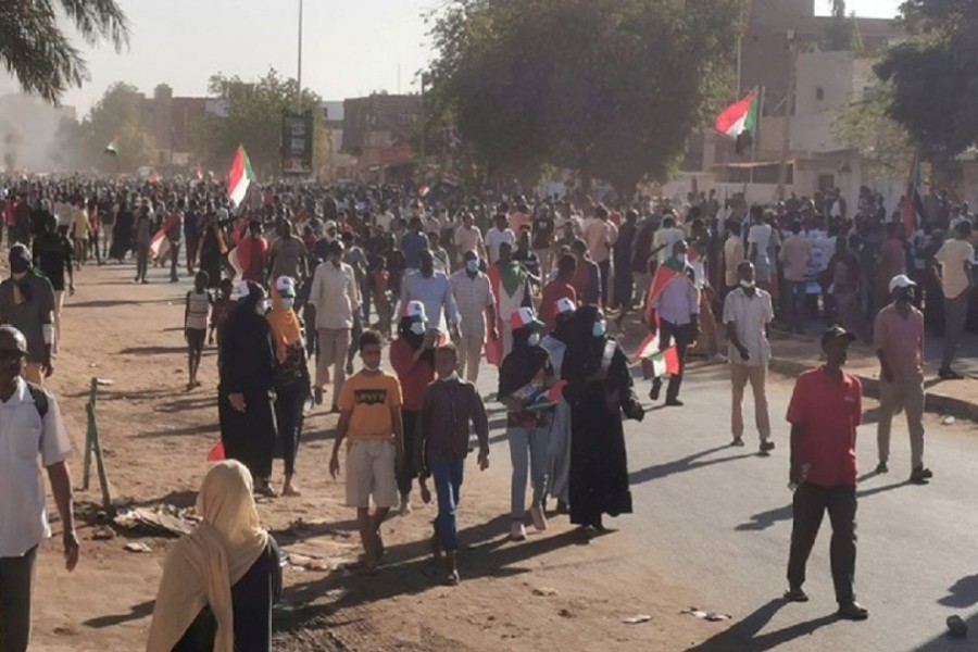 People hold Sudanese flags during a protest, in Khartoum, Sudan, November 25, 2021. REUTERS