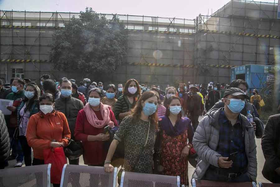 Parents waiting for children receiving the Pfizer-BioNTech vaccine for COVID-19 in Kathmandu of Nepal on November 23 this year -AP file photo